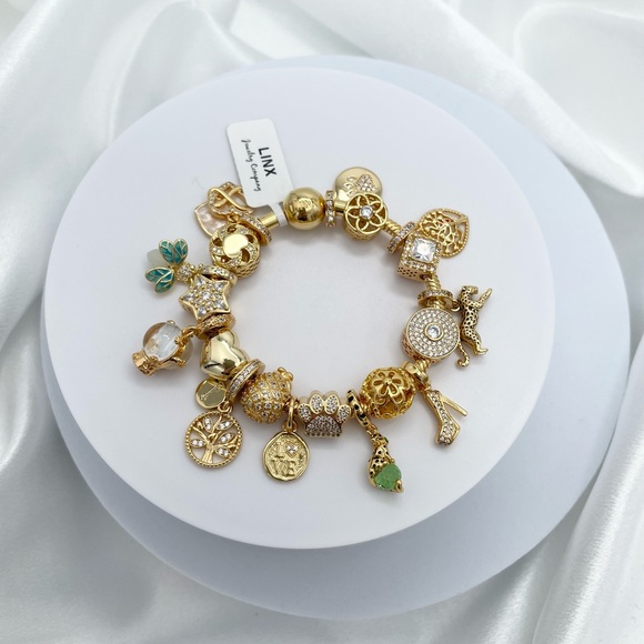 Linx Yellow Gold Bracelet with Gold and Green Themed Charms